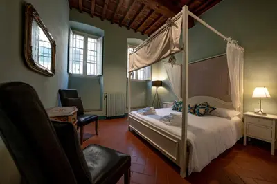 Letto o letti in una camera di Raffinato trilocale San Frediano