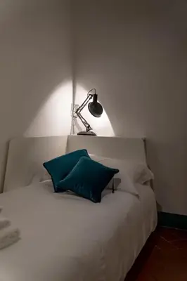 Letto o letti in una camera di Raffinato trilocale San Frediano