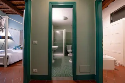 Letto o letti in una camera di Raffinato trilocale San Frediano