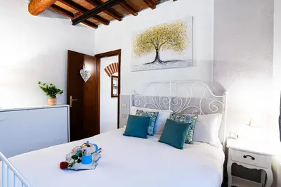 Letto o letti in una camera di La Buca dei Sogni