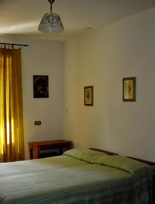 Letto o letti in una camera di Affittacamere DaMammaSara