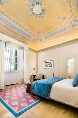 Letto o letti in una camera di Duca Marco-La Dimora degli Affreschi Florence