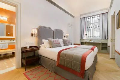 Letto o letti in una camera di Duca Marco-La Dimora degli Affreschi Florence