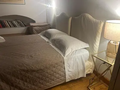 Letto o letti in una camera di Rondinelli Charme Bijoux - Elegance in the heart of Florence