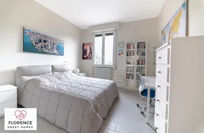 Letto o letti in una camera di Tommaso Apartment with free parking by Florence Sweet Homes