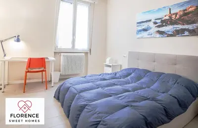 Letto o letti in una camera di Tommaso Apartment with free parking by Florence Sweet Homes