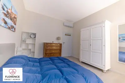 Letto o letti in una camera di Tommaso Apartment with free parking by Florence Sweet Homes