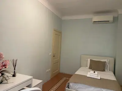 Letto o letti in una camera di Homelink Firenze - De' Medici