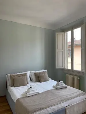 Letto o letti in una camera di Homelink Firenze - De' Medici