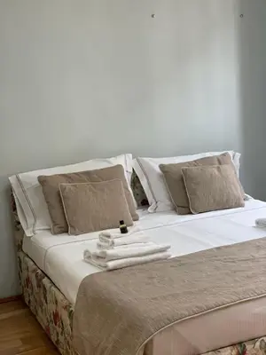 Letto o letti in una camera di Homelink Firenze - De' Medici