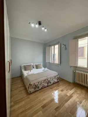 Letto o letti in una camera di Homelink Firenze - De' Medici