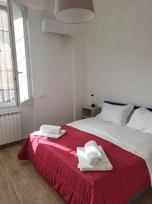 Letto o letti in una camera di Casa Patti Firenze