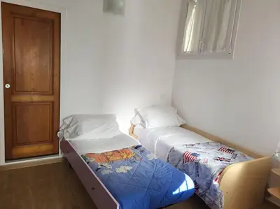 Letto o letti in una camera di Casa Patti Firenze