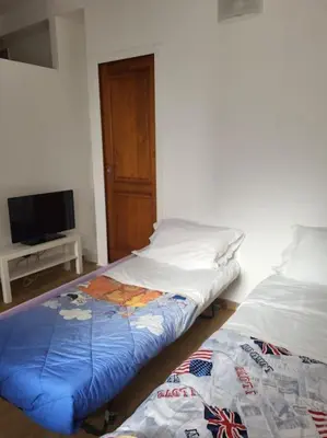 Letto o letti in una camera di Casa Patti Firenze