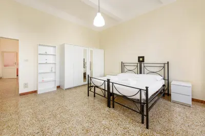 Letto o letti in una camera di Lorena Firenze by Mmega
