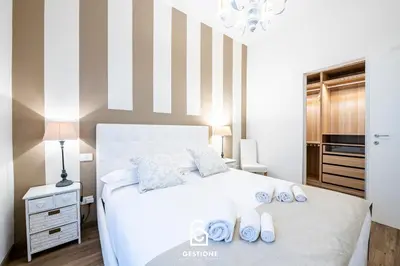 Letto o letti in una camera di 20 Minuti Ponte Vecchio - Delizioso Appartamento