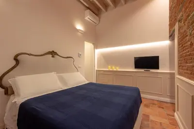 Letto o letti in una camera di Ognissanti Family Suite in great location