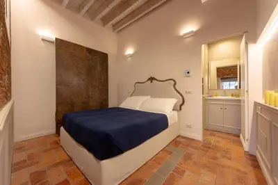 Letto o letti in una camera di Ognissanti Family Suite in great location