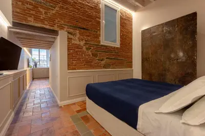 Letto o letti in una camera di Ognissanti Family Suite in great location