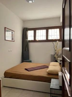 Letto o letti in una camera di Bilocale confortevole a due passi dalla stazione