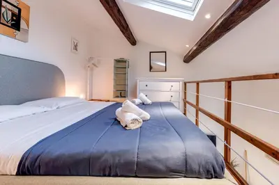 Letto o letti in una camera di Vicolo Piazza Libertà-Centro