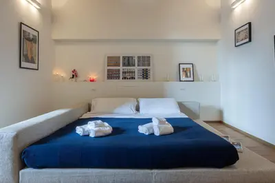 Letto o letti in una camera di OGNISSANTI Romantic Suite