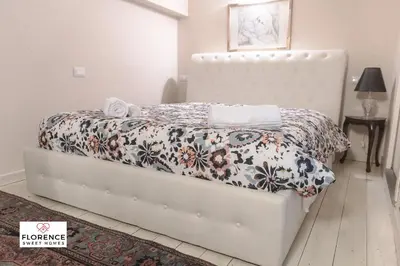 Letto o letti in una camera di Loft Matteotti by Florence Sweet Homes