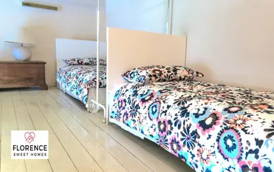 Letto o letti in una camera di Loft Matteotti by Florence Sweet Homes