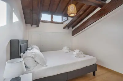 Letto o letti in una camera di Palazzo Borghese Apartment with Panoramic Terrace
