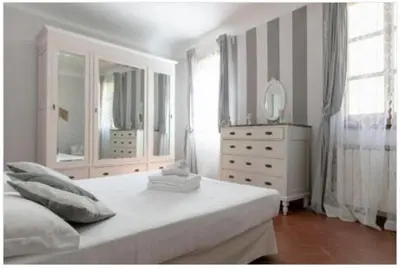 Letto o letti in una camera di La Perla di Porcellana Santa Maria Novella