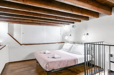 Letto o letti in una camera di GuestHost - Il Covo di Camillo - Central and Charming Apartment