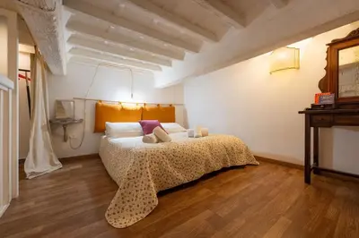 Letto o letti in una camera di Keys of Italy - Laura 34 - Monolocale soppalcato centrale e silenzioso