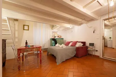 Letto o letti in una camera di Keys of Italy - Laura 34 - Monolocale soppalcato centrale e silenzioso
