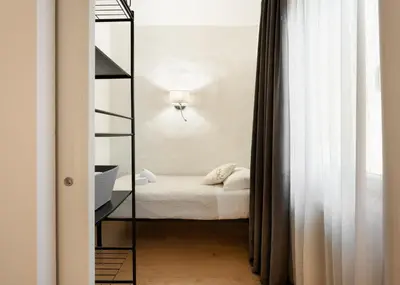 Letto o letti in una camera di Keys of Italy - Albero 15 - Big and Small apt by Train station 2nd floor