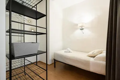 Letto o letti in una camera di Keys of Italy - Albero 15 - Big and Small apt by Train station 2nd floor