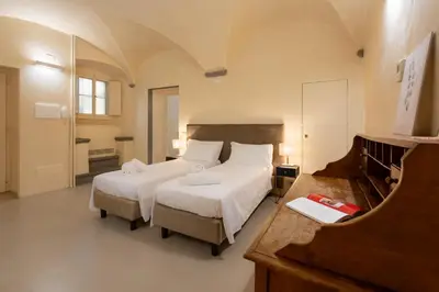 Letto o letti in una camera di Keys of Italy - Benci 20 Fresco - Frescoes one bedroom Santa Croce
