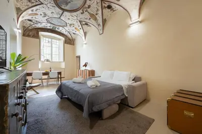 Letto o letti in una camera di Keys of Italy - Benci 20 Fresco - Frescoes one bedroom Santa Croce