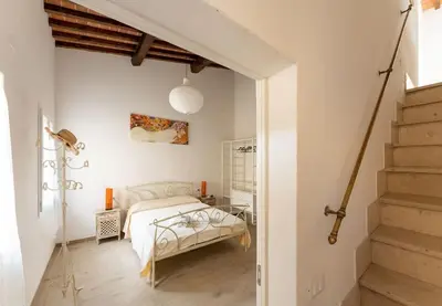 Letto o letti in una camera di Keys of Italy - Maytreya - Albero 2 - Train station two bedroom flat 2nd floor
