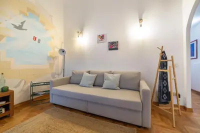 Area soggiorno di La casa del murales per 6 persone vicino al mercato