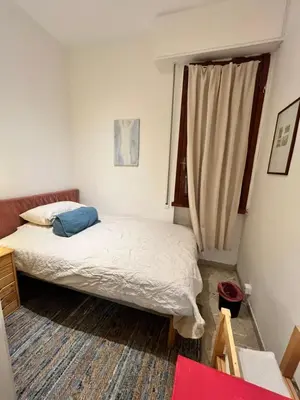 Letto o letti in una camera di Monolocale Firenze Robbia