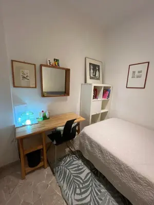Letto o letti in una camera di Monolocale Firenze Robbia