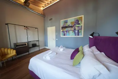 Letto o letti in una camera di Sant'Agostino Luxury Apartment by Mamo Florence