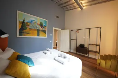 Letto o letti in una camera di Sant'Agostino Luxury Apartment by Mamo Florence