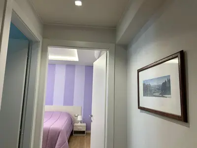 Letto o letti in una camera di Etrusco Viola - Appartamento 