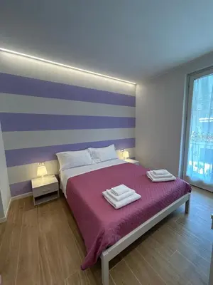 Letto o letti in una camera di Etrusco Viola - Suite Giglio Rosso