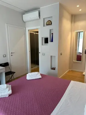Letto o letti in una camera di Etrusco Viola - Suite Giglio Rosso