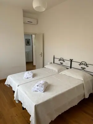 Letto o letti in una camera di Appartamento Imperia • Firenze