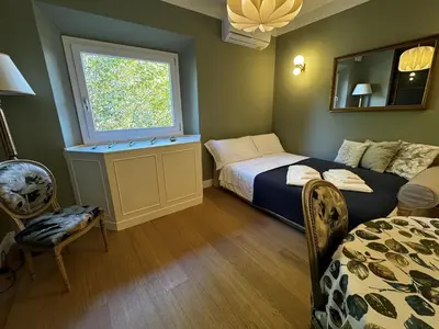 Letto o letti in una camera di Casa dì
