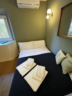 Letto o letti in una camera di Casa dì