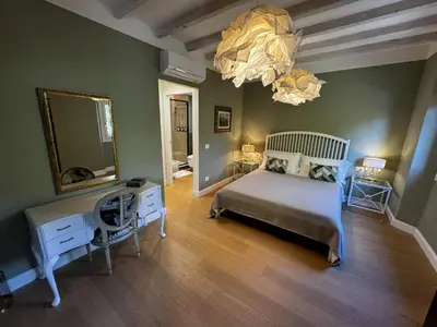 Letto o letti in una camera di Casa dì